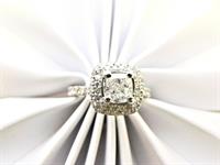 Halo style diamond engagement ring on white gold