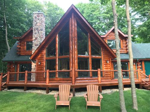 - Stain full log home - Tear off old decking and railing - Install new Zuri Composite Decking - Supply and Install new custom White Cedar Log Railing  - Stain new Log Railing
