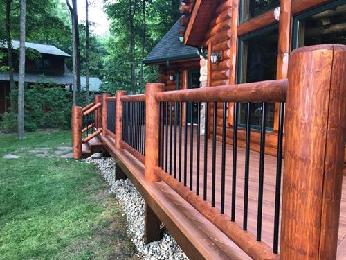 - Stain full log home - Tear off old decking and railing - Install new Zuri Composite Decking - Supply and Install new custom White Cedar Log Railing  - Stain new Log Railing