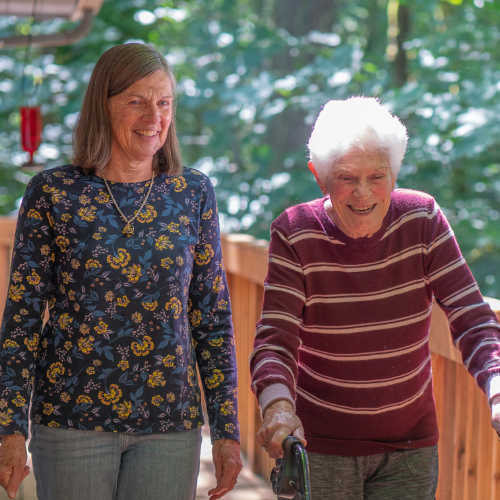Caregiver building a relationship with client through walks.
