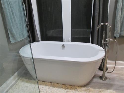 Elegant bath renovation combining timeless design and quality materials — part of our full-service remodeling expertise at Lucius Complete Home.