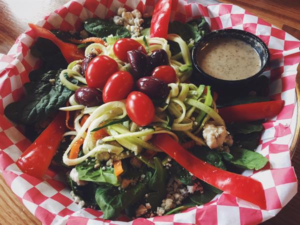 Enjoy bites from our small menu including the Bird Nest Salad. 