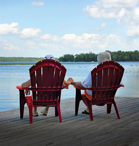 Couple relaxing and holding hands on Leech Lake