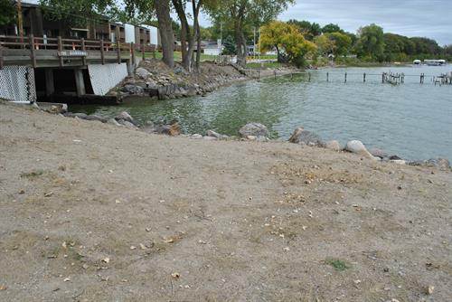 State owned shoreline in front of complex has sand area that can be used as a beach.