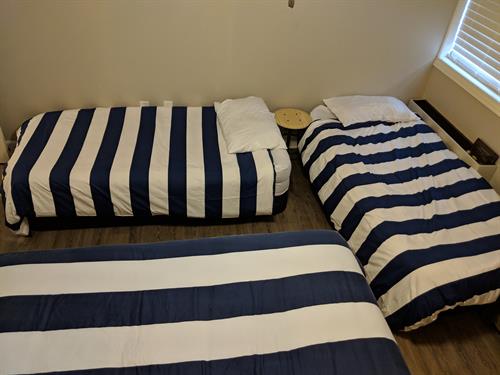 Back bedroom with twin air beds setup 
