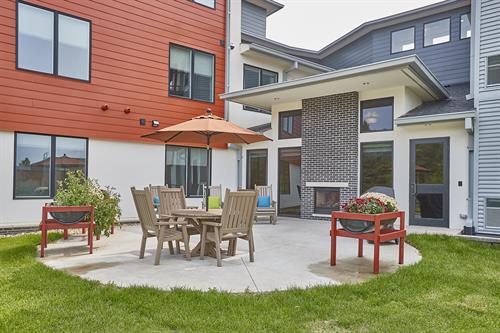 Outdoor Patio with Raised Gardens and Community Grill