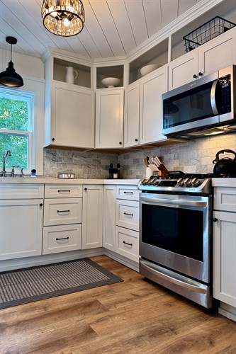 Fully stocked remodeled kitchen with an LG gas range and plenty of prep space.