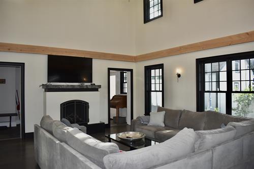 large livingroon with vaulted ceiling and loft