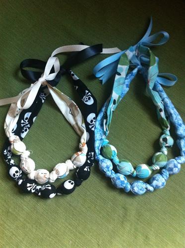 Mamas love the teething/nursing necklaces.  Give baby something to chew on or play with while you hold them.