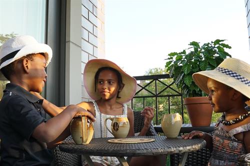 Nia, Ari, Zoe - our three kids graciously posing with our signature Kikwetu mugs