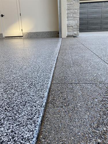 Residential flake epoxy and sealed concrete driveway