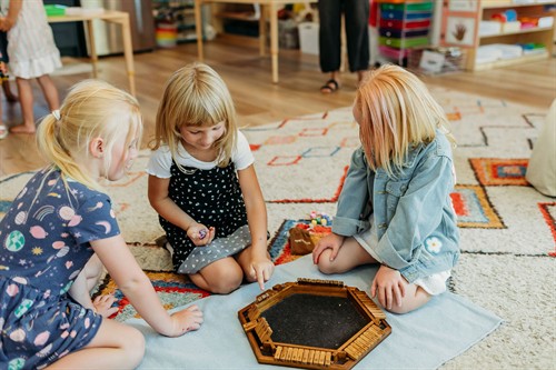Spark learners playing a game in the Acton Academy St. George preschool studio. 