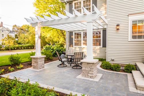 We replaced a small, awkward deck with this open, inviting patio and pergola.