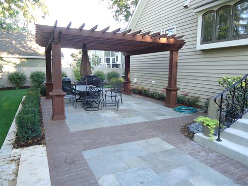 Bluestone, clay pavers, and a custom pergola - a few of our favorite things!