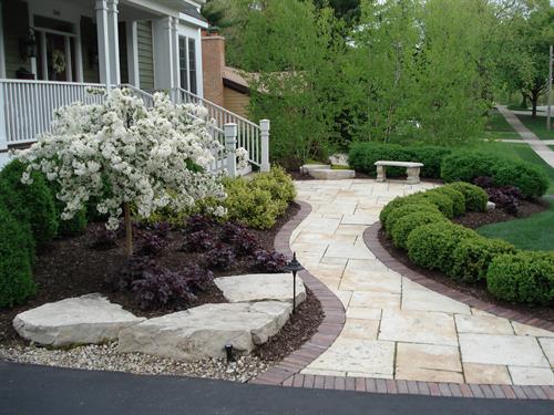 Lush plantings give this updated front walk a ton of curb appeal.