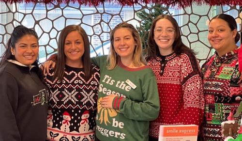 Christmas sweaters never go out of style in our office!