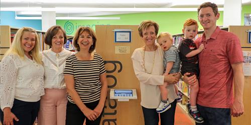 Mary Lou Skalkos and family being honored by the Library Foundation with a stack dedication naming as a thank you from the 2023 Silver Ball 