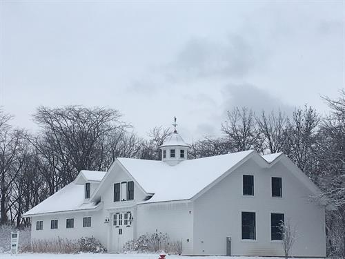 Snow covers the Stable building