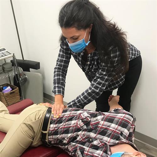 Gallery Image Dr_Ivana_(Monserrate)_Vargas._DC_-_Chiropractor_performing_Active_Release_Techniques_for_Low_Back_Pain.jpg