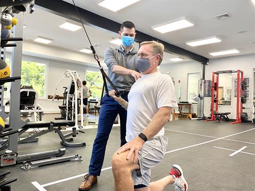 Gallery Image Justen_Lopez_-_Certified_Athletic_Trainer_assisting_patient_during_their_physical_therapy_session.jpg