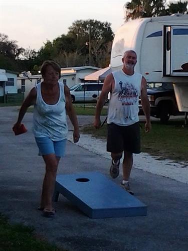 Playing Cornhole after our monthly get together!