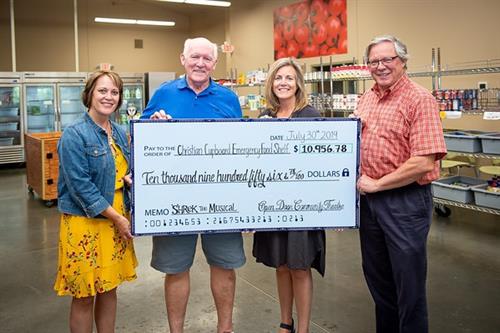 ODCT's donation of nearly $11,000 to the Christian Cupboard Emergency Food Shelf following Shrek the Musical!