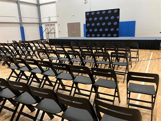 Gallery Image gym_stage_with_BGC_stepandrepeat_75_chairs.jpg