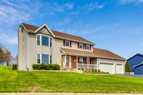 Gallery Image Exterior_Front_angle_with_blue_house_showing.jpg