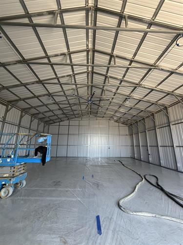 Closed-cell spray foam installed on a metal building—adding strength, air sealing, and long-term energy efficiency. Built to perform.