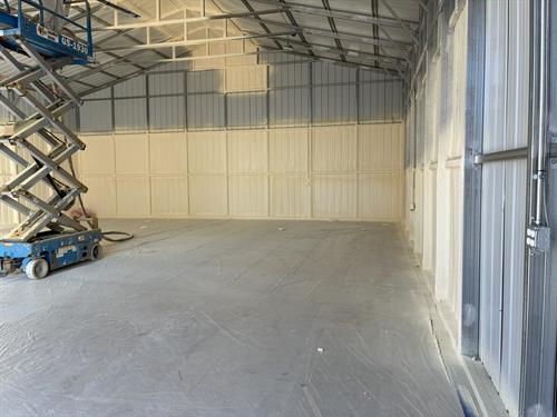 Metal building insulated with closed-cell spray foam for a tight envelope, vapor barrier, and long-term performance.