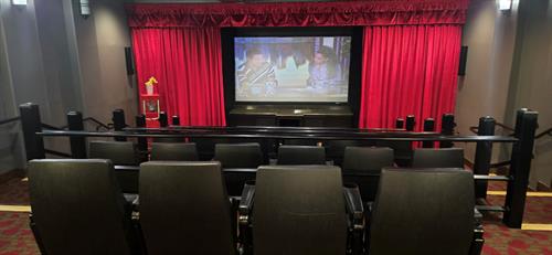 Eat some popcorn in our theater! 