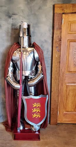 The silver knight greets guests in the foyer at Castle Waterford.