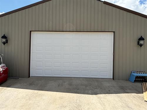 Large garage door replacement after wind blew the door in. 