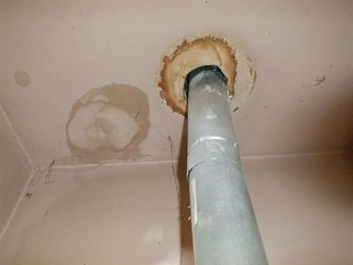 Water damage in water heater closet