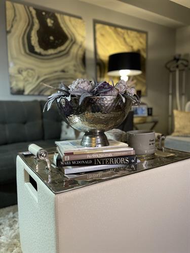 This flower arrangement showcases a unique and sophisticated stainless steel base, with an eye-catching amethyst gray-purple crystal at its center.