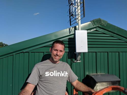 Solinkit engineer deploying UniFi Mesh system..