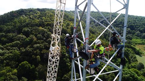 men working on a tower