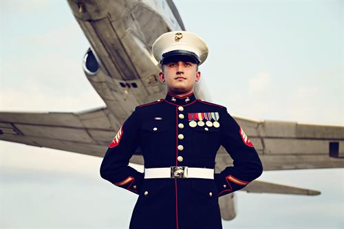 Soldier with Airplane flying behind him by Ziegler Photography