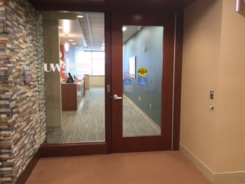 UW Health logo printed on glass door