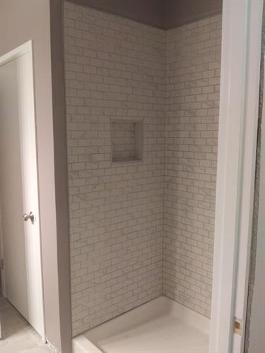 Tile shower with built in shelf