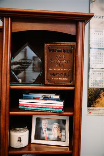 View of bookshelf with awards