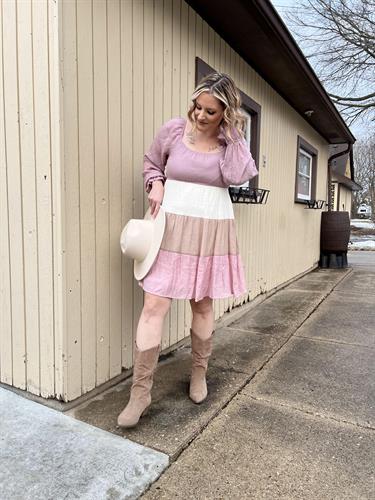 Pink striped dress with cowgirl hat and healed boots