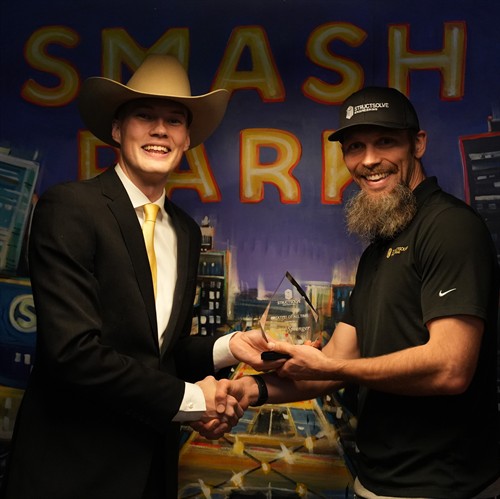 Gallery Image Square_Travis_Award.JPG