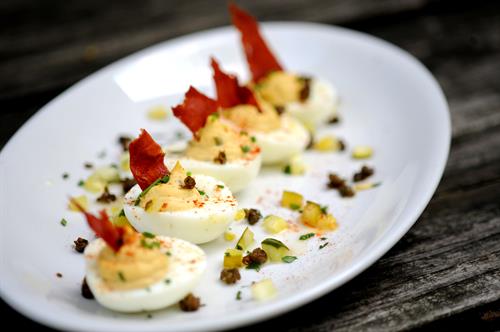 DEVILED EGGS  CRISPY PROSCIUTTO, FRIED CAPERS & SMOKED PAPRIKA