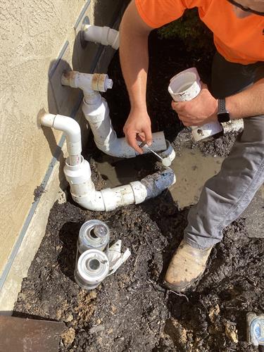 We glue fittings on our underground pipes