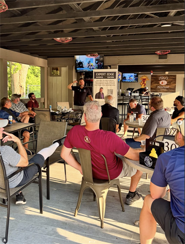 R.J. presenting to business owners at Harry Buffalo