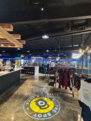 Logo Light projecting The Spot Gym at their indoor entryway