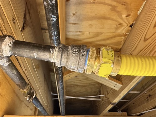 Gas line hookup under a home in Marietta