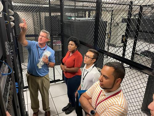 CEO, Leon Hart, explains the intracies of a data center to UCF STEM students.