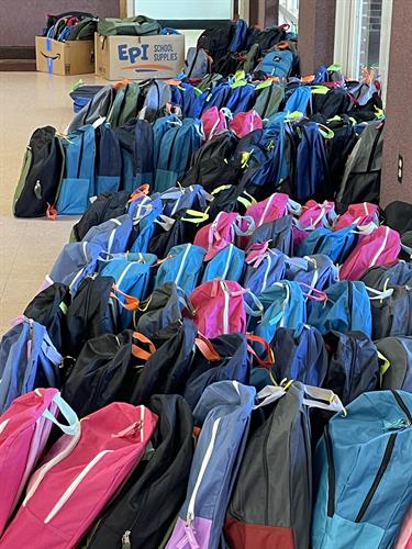 We annually provide hundreds of filled backpacks to children in need